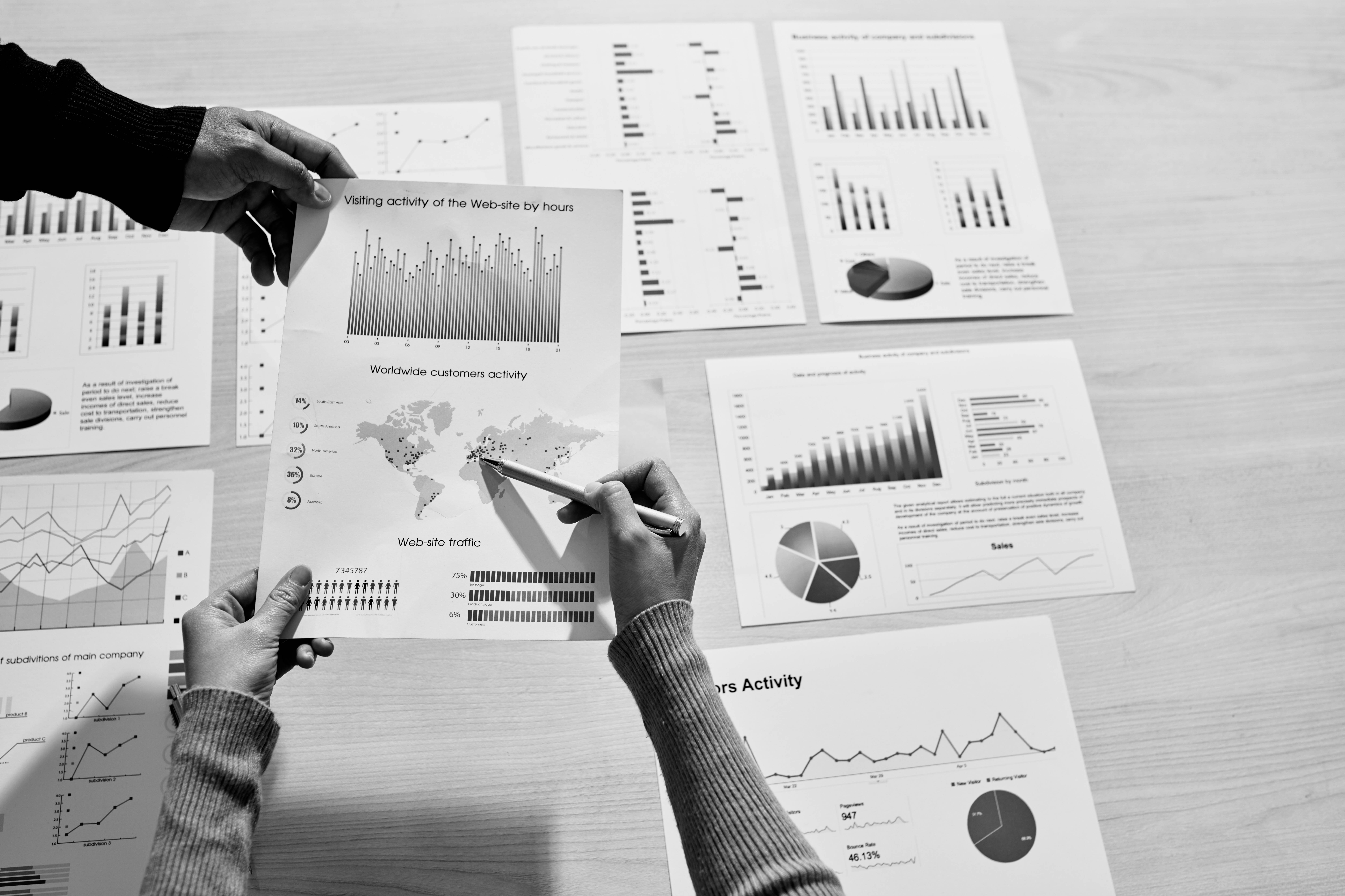 Hands of businessman giving document with website visiting activity chart to coworker