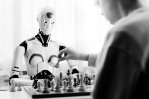 AI and Human Youth and technology combine in a game of chess.