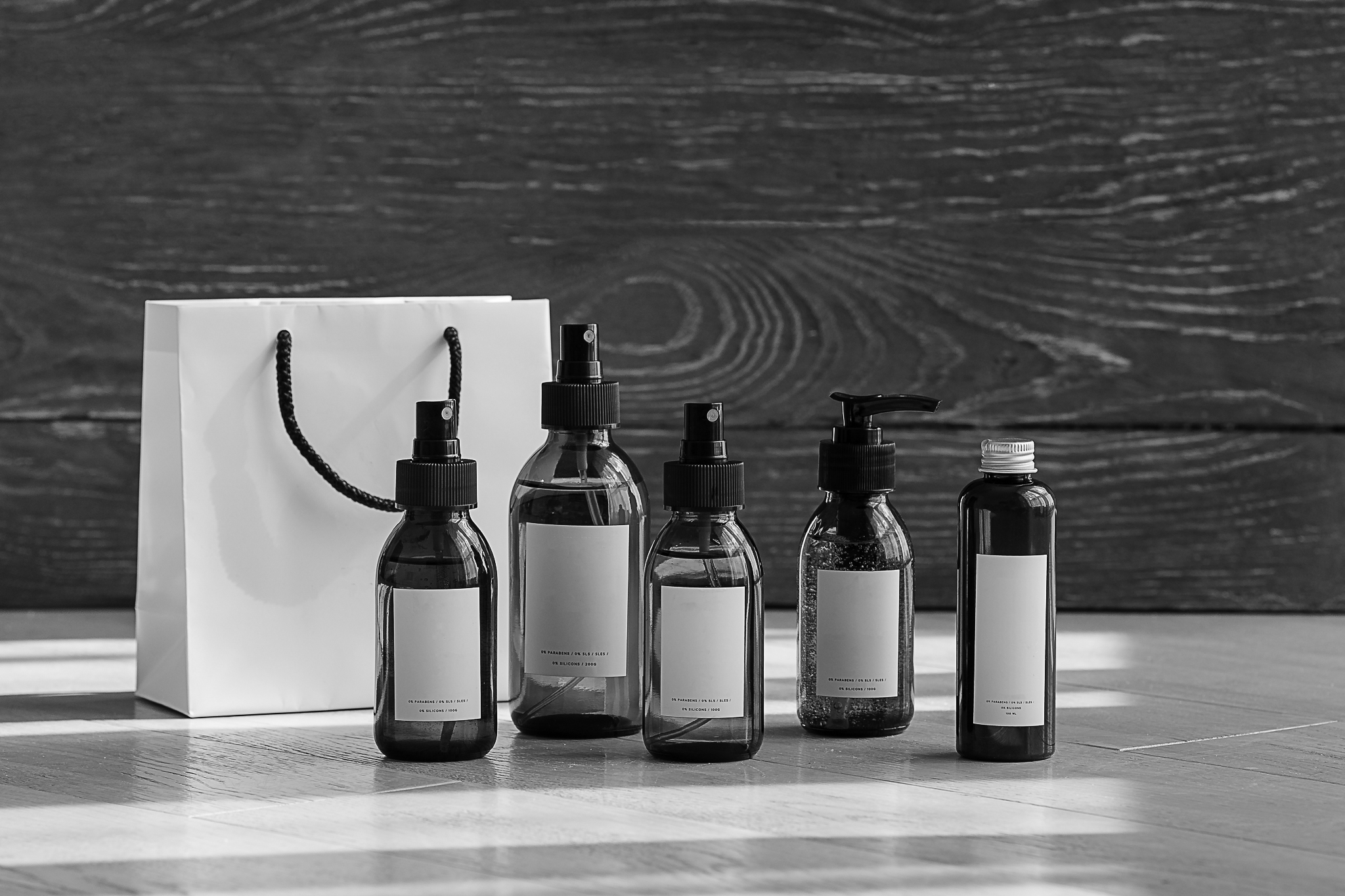 cosmetic-dark-amber-glass-bottles-on-wooden-backgr-2023-11-27-05-20-27-utc