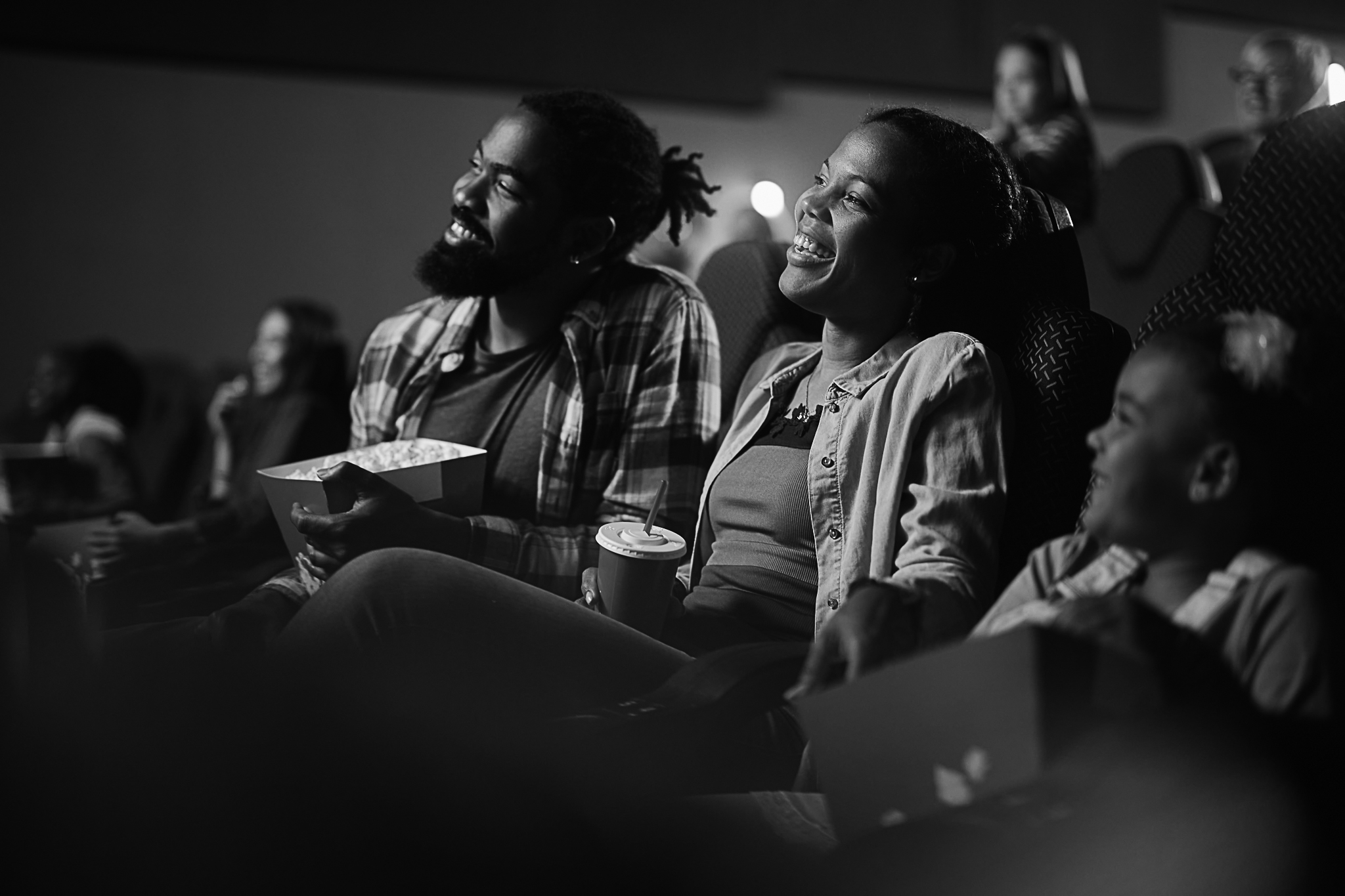 happy-black-family-enjoying-in-watching-a-movie-in-2023-11-27-04-54-24-utc