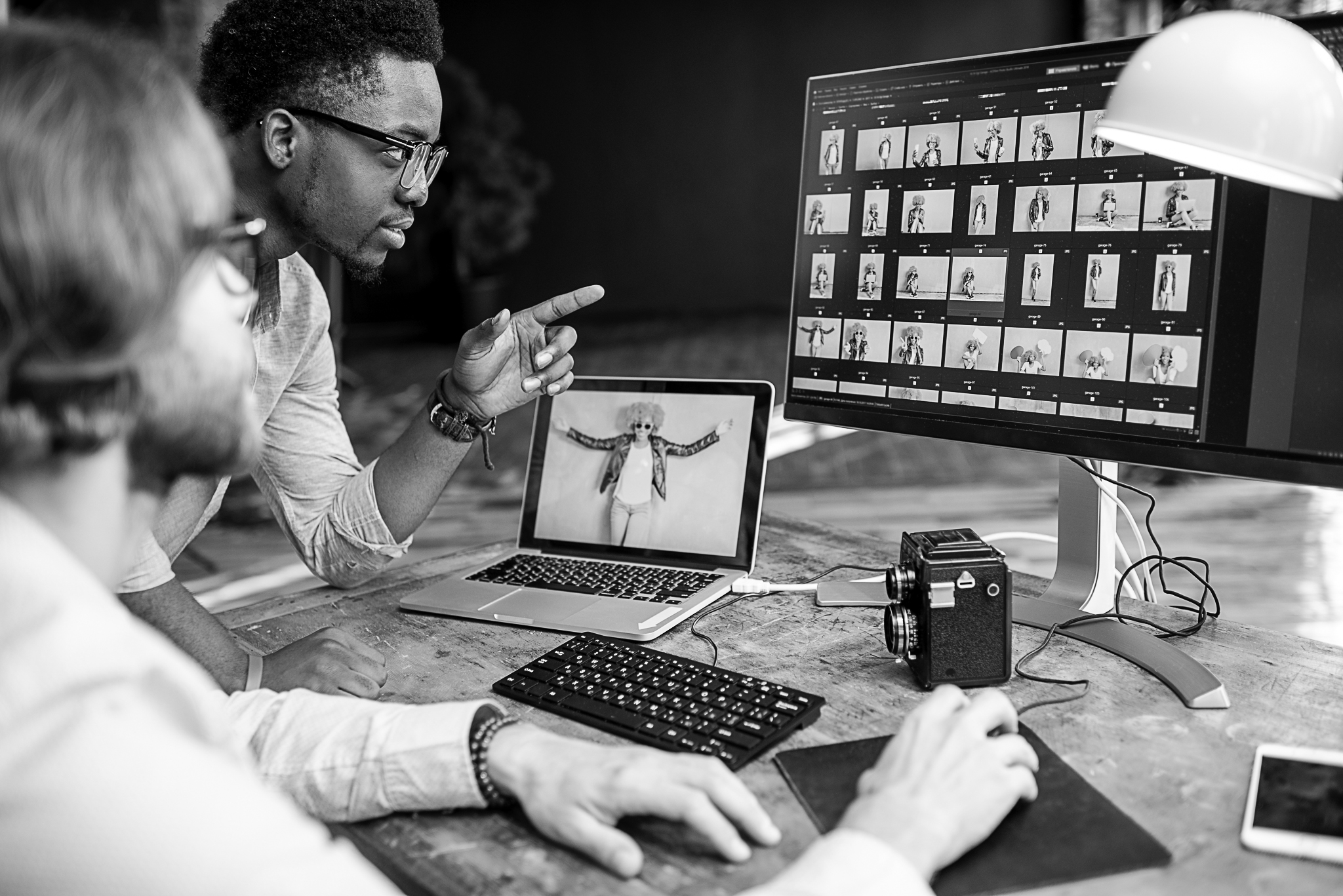 two-photographers-working-on-the-computers-in-the-2023-11-27-04-58-01-utc